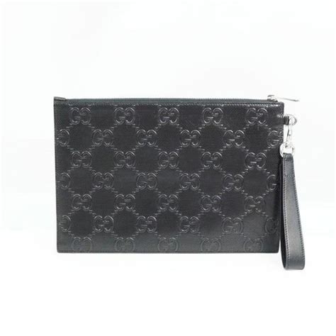 gucci embossed clutch mechanic